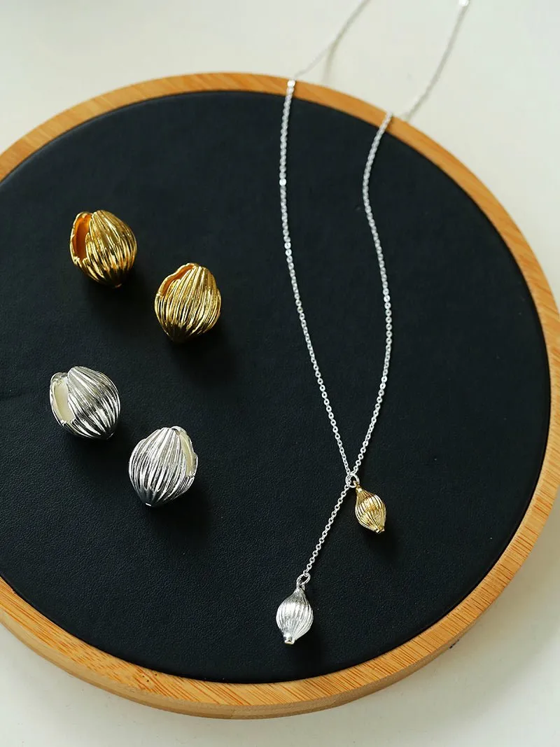 Long Gold and Silver Textured Seed Pendant Necklace