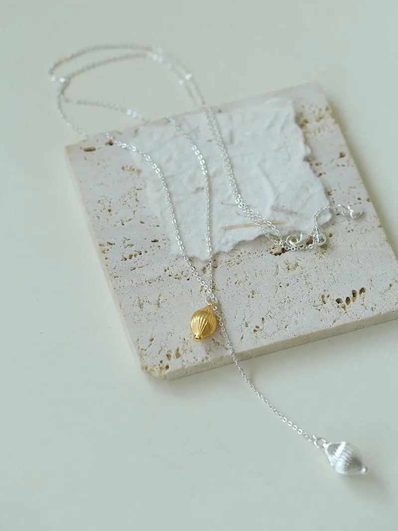 Long Gold and Silver Textured Seed Pendant Necklace